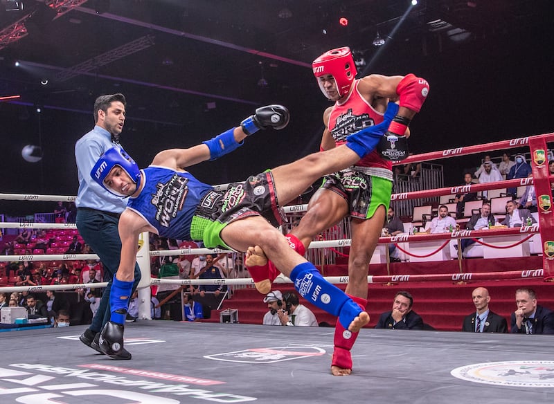 UAE's Ilyass Habibali, in red, defeats Mustafa Al Tekreet of Iraq during the semi-finals at the IFMA Muaythai World Championships at ADNEC in Abu Dhabi on Thursday, June 2, 2022. All pictures Victor Besa / The National