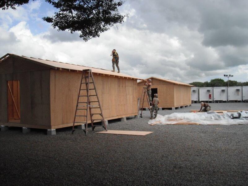 US Navy personnel work on construction of huts at Camp Simba in Lamu in December 2015. EPA