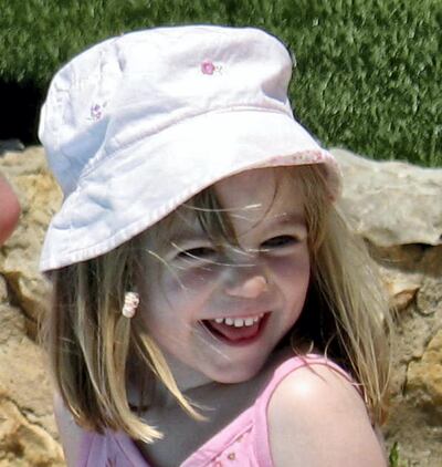 Picture released by the McCann family 24 May 2007 and was taken 03 May 2007, the same day Madeleine McCann (R) went missing from the family's holiday apartment in the southern Algarve region. Madeleine was abducted as she slept with her brother and sister in a hotel apartment at the Ocean Club Resort while her parents dined at a nearby restaurant.   AFP PHOTO/HO (Photo by FAMILY HANDOUT / AFP)