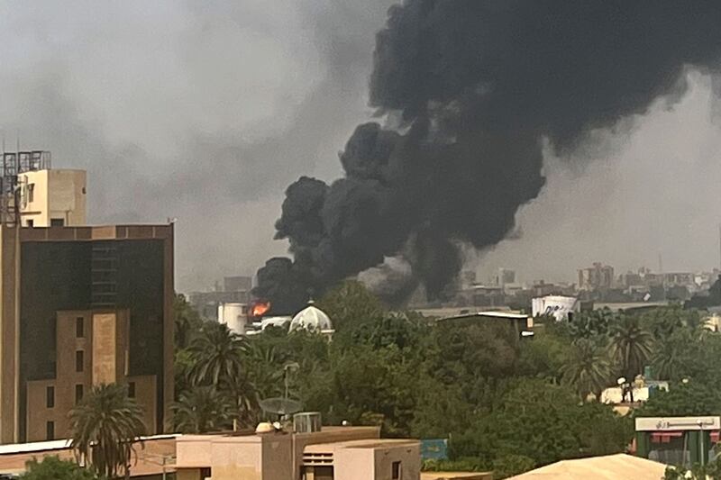 Smoke billows above residential buildings in Khartoum on April 16 as fighting in Sudan raged for a second day in battles between rival generals. AFP