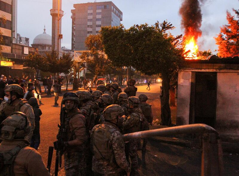 Army soldiers stand guard near the government Serail building during a protest against the lockdown and worsening economic conditions, amid the spread of the coronavirus disease (COVID-19), in Tripoli, Lebanon. Reuters