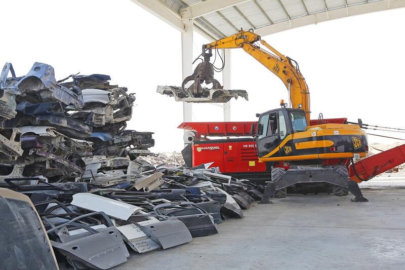 The main purpose of the metal shredding machine, seen in background, is the separation of car bodies and other metal scrap from other materials at the Bee’ah waste management facility in Sharjah. Jeffrey E Biteng / The National  