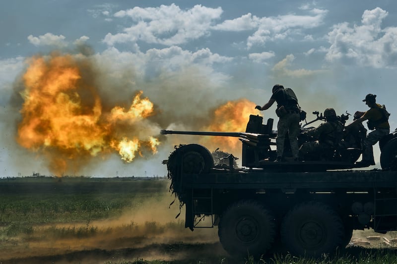 Ukrainian soldiers fire a cannon on the front line near Bakhmut. AP