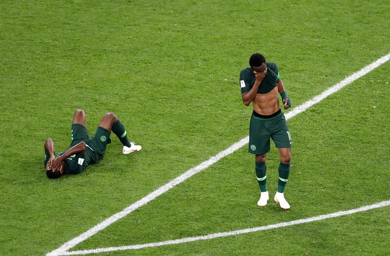 Nigeria players react at the end of the group D match between Argentina and Nigeria. Michael Sohn / AP photo