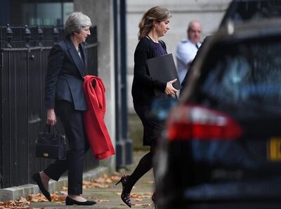 LONDON, ENGLAND - NOVEMBER 15:  British Prime Minister Theresa May leaves Number 10 Downing Street through the back door on November 15, 2018 in London, England. Cabinet Ministers Dominic Raab, the Brexit Secretary, and Esther McVey, Work and Pensions Secretary resigned this morning after last night's cabinet meeting backed the draft Brexit agreement. (Photo by Leon Neal/Getty Images)