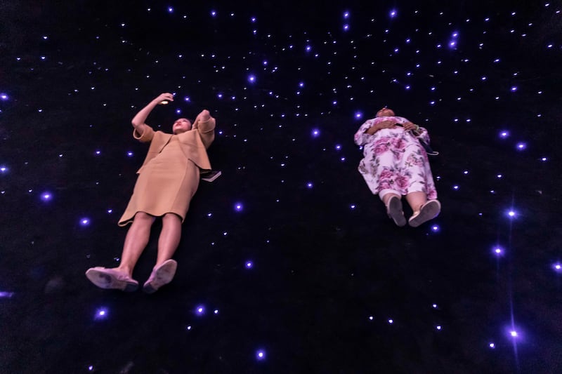 One room requires visitors to lay on their backs and watch a light show projected on the ceiling — the idea is to create an illusion of floating