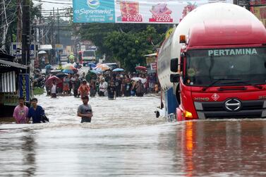 A lorry drives through a flooded road on the outskirts of Jakarta on January 1, 2020. AP Photo