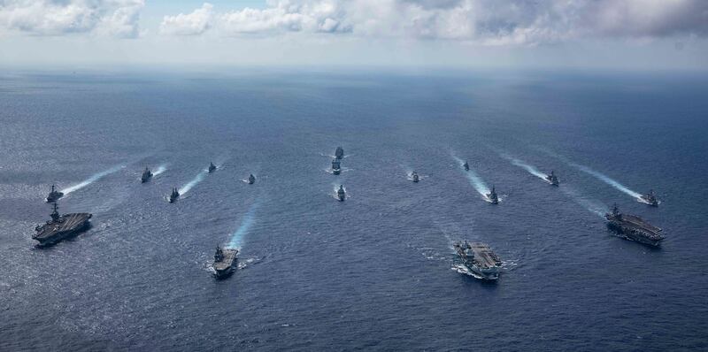 HMS Queen Elizabeth leading a carrier strike group alongside US carriers and Japanese warships during exercises in 2021. AP