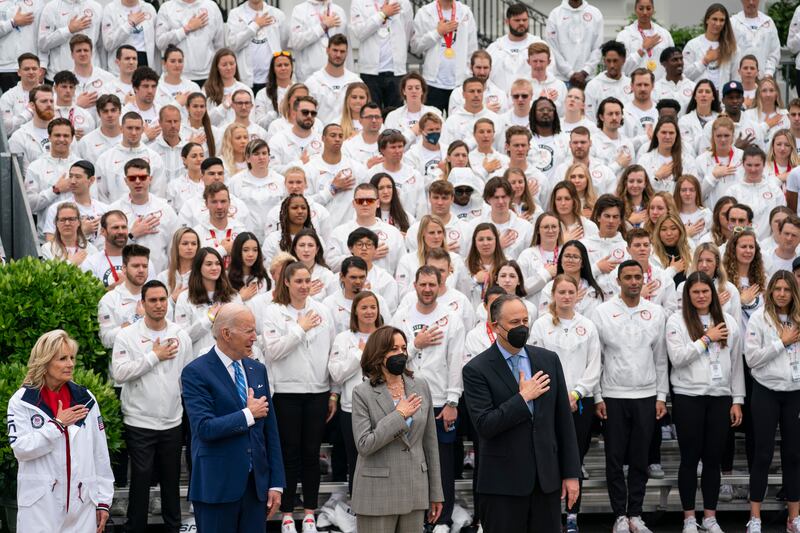 US President Joe Biden, first lady Jill Biden, Vice President Kamala Harris, and second gentleman Douglas Emhoff stand for the American nation anthem. AP