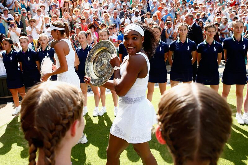 Serena Williams leaves court with the Venus Rosewater Dish after her victory in the final of the Ladies' Singles in 2015. She has won the title seven times.