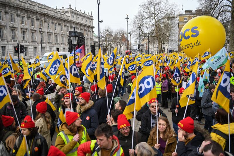 Striking civil servants from the Public and Commercial Services Union march along Whitehall, in central London. Bloomberg