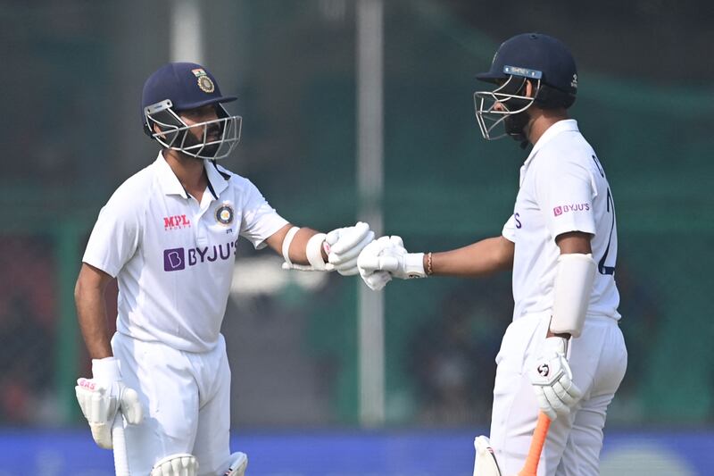 Cheteshwar Pujara, right, and Ajinkya Rahane have been dropped from the India Test team. AFP