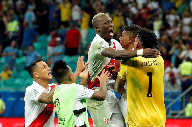 Peru goalkeeper Pedro Gallese is mobbed by teammates after the Copa America quarter-final win over Uruguay. EPA