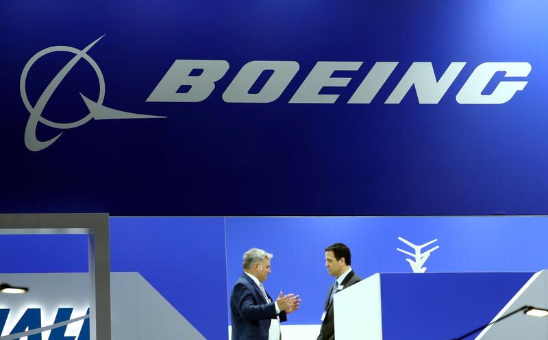 FILE PHOTO: Visitors talk on the Boeing stand during the European Business Aviation Convention & Exhibition (EBACE) at Cointrin Airport in Geneva, Switzerland May 21, 2019. REUTERS/Denis Balibouse/File Photo