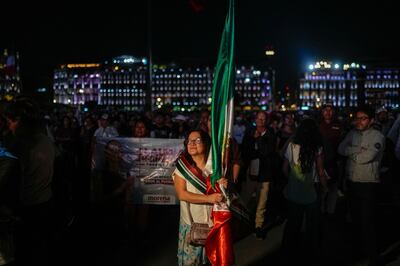 Supporters of new Mexico President Claudia Sheinbaum await her arrival at the main square in Mexico City. AP