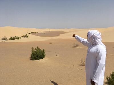 Hosn al Sirra. Omar al Kaabi, from the Department of Culture and Tourism, points the way to Abu Dhabi. Photo credit: Tim Power.