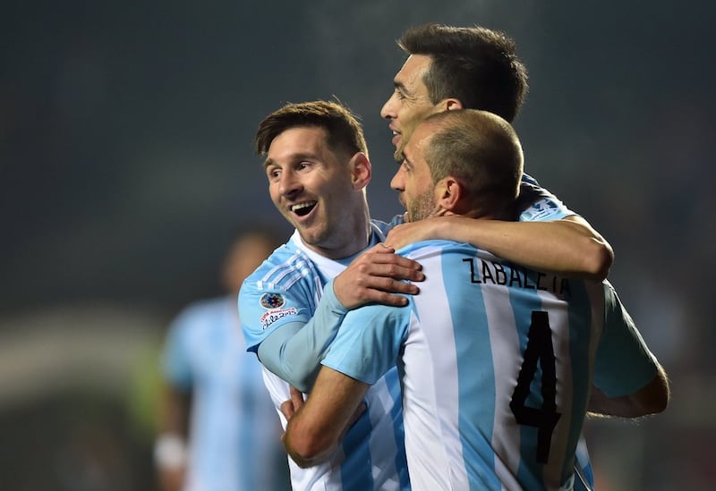Argentina's Lionel Messi, Javier Pastore and Pablo Zabaleta celebrate during their win on Tuesday night to reach the Copa America final. Yuri Cortez / AFP