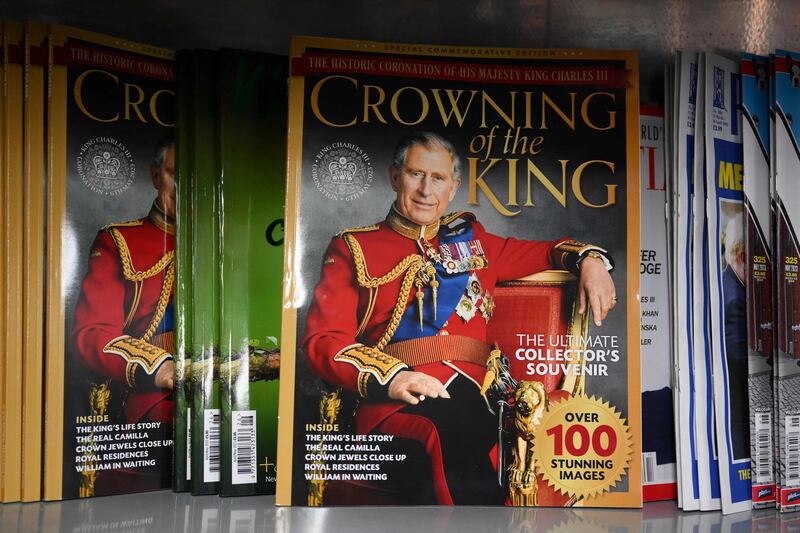 The official 'Crowning of the King' souvenir programme sits on a shop shelf in central London. AFP
