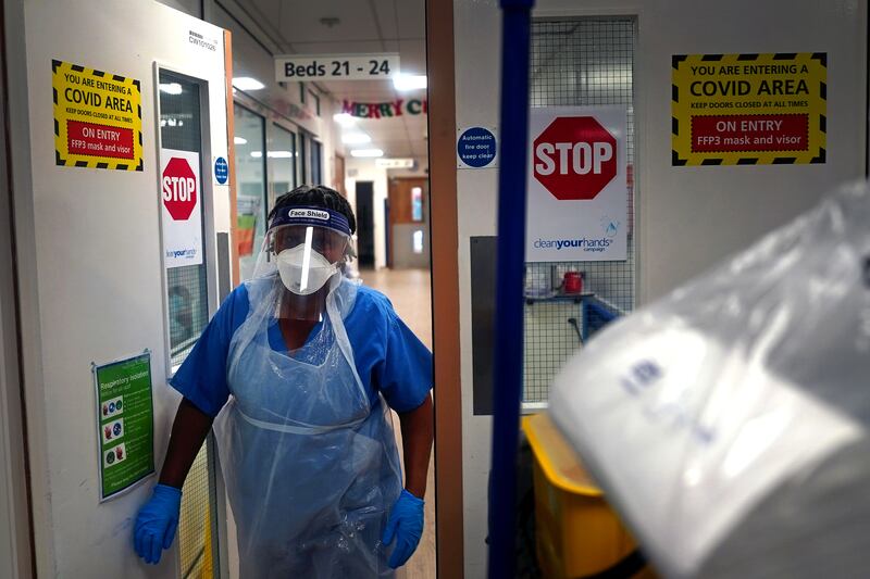 A member of staff walks through a ward for Covid-19 patients at King's College Hospital in London. PA