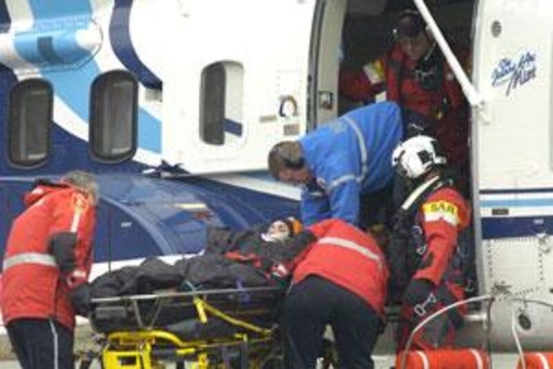 A survivor is lifted out of a helicopter at the Health Sciences Center in St John's, New Foundland, Canada, on March 12, 2009.