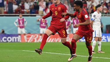 Spain's midfielder #09 Gavi (L) celebrates scoring his team's fifth goal during the Qatar 2022 World Cup Group E football match between Spain and Costa Rica at the Al-Thumama Stadium in Doha on November 23, 2022.  (Photo by Glyn KIRK  /  AFP)