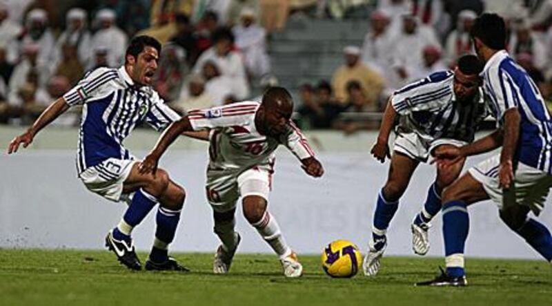 The UAE forward Ismail Matar, centre, has a torn cartilage in his ankle.