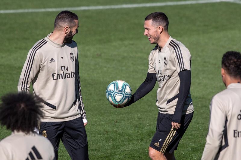 Real Madrid's Karim Benzema, left, and Eden Hazard during training at the Valdebebas sport city. EPA