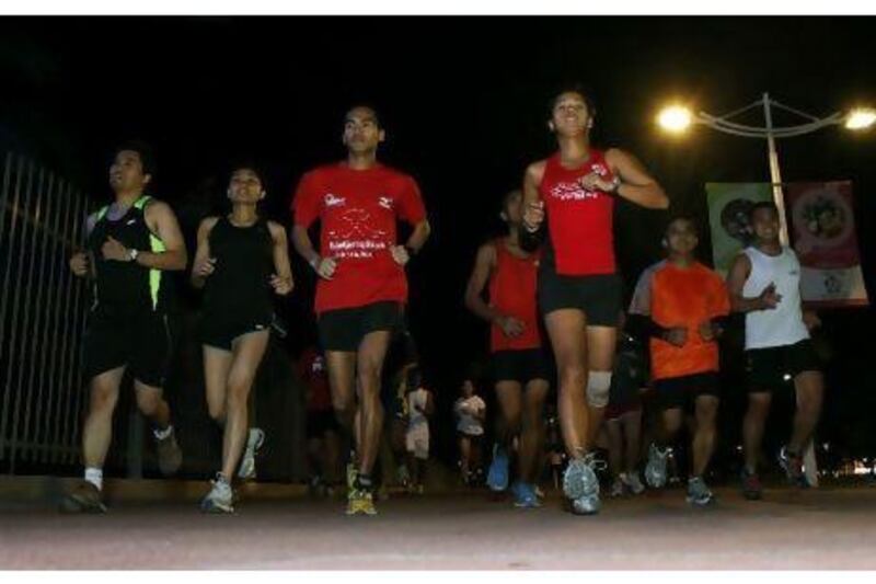 Euca Bolingot, third from left, leads the Filipino Runners UAE during a recent training session.