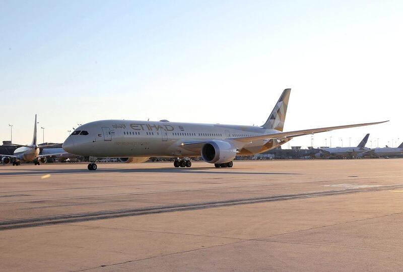 Etihad Airways’ Boeing 787 Dreamliner touches down at Dulles International Airport marking the Abu Dhabi carrier’s inaugural service to Washington DC. Paul Morigi / Getty Images for Etihad