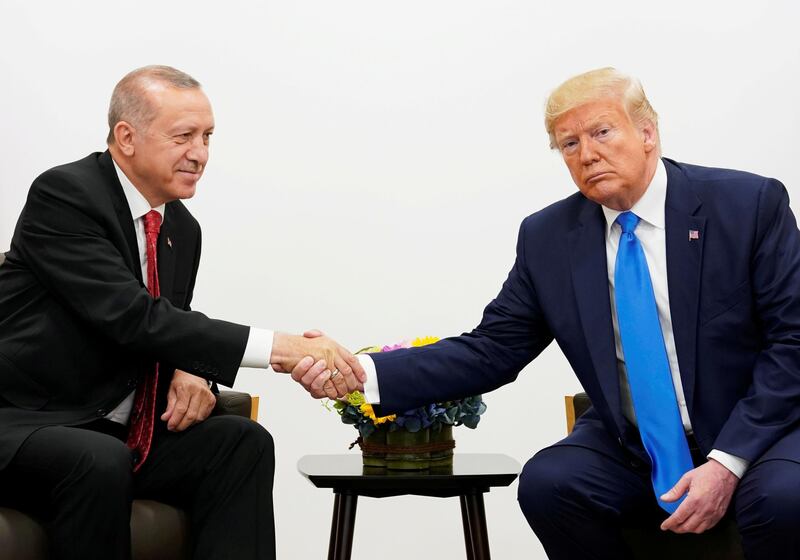 FILE PHOTO: U.S. President Donald Trump shakes hands during a bilateral meeting with Turkey's President Tayyip Erdogan during the G20 leaders summit in Osaka, Japan, June 29, 2019. REUTERS/Kevin Lamarque/File Photo