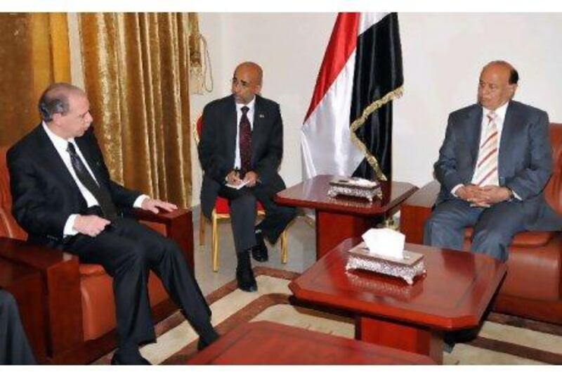 Yemeni vice-president Abed Rabbo Mansour Hadi (right), pictured with the US ambassador to Yemen, Gerald Feierstein (left). Mr Hadi has taken on executive duties in the president's absence. Yemen Presidential Palace / EPA