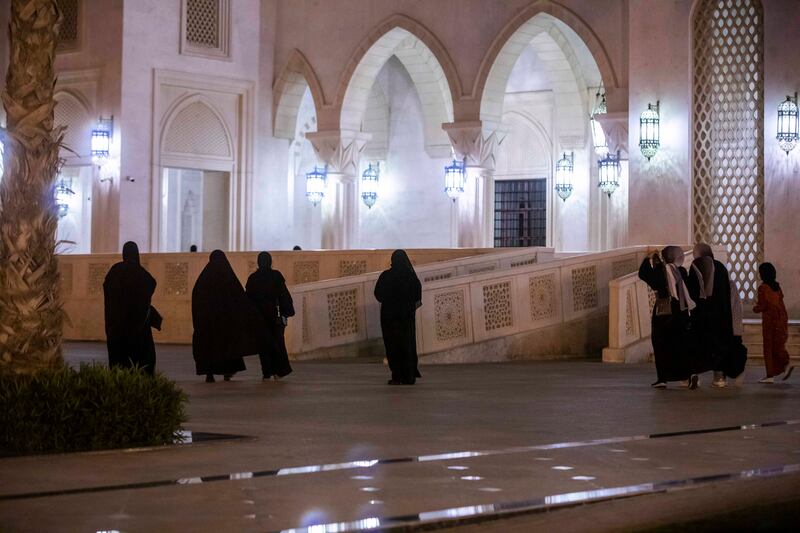 Worshippers arrive at Sheikh Zayed Mosque, the second largest in the UAE, for the first evening prayer of Ramadan. Leslie Pableo for The National