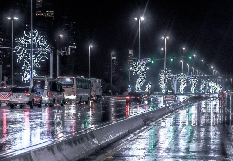 Abu Dhabi, United Arab Emirates, April 15, 2020.  The newly installed Ramadan lights on the Corniche during the rains.
Victor Besa / The National
Section:  NA
For:  Standalone/Stock Images