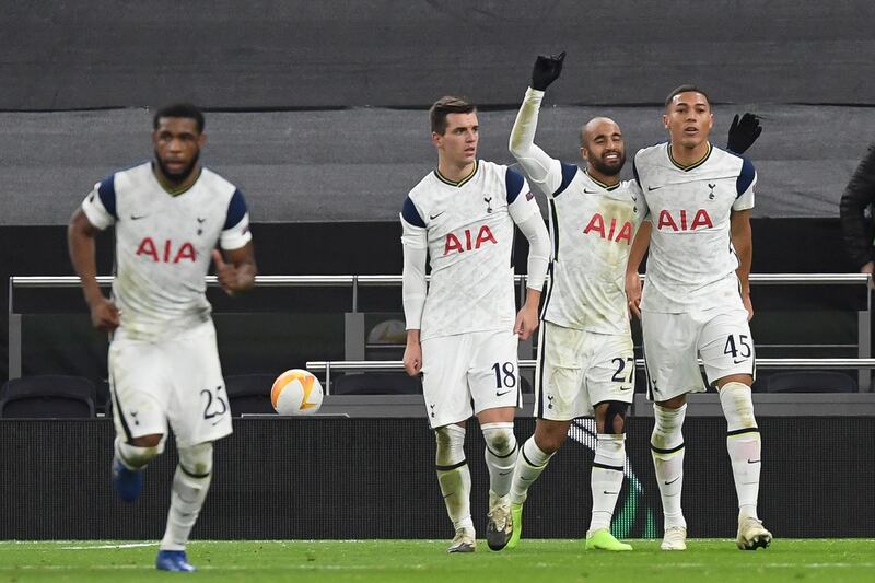 Tottenham's Carlos Vinicius celebrates with teammates after opening the scoring. EPA