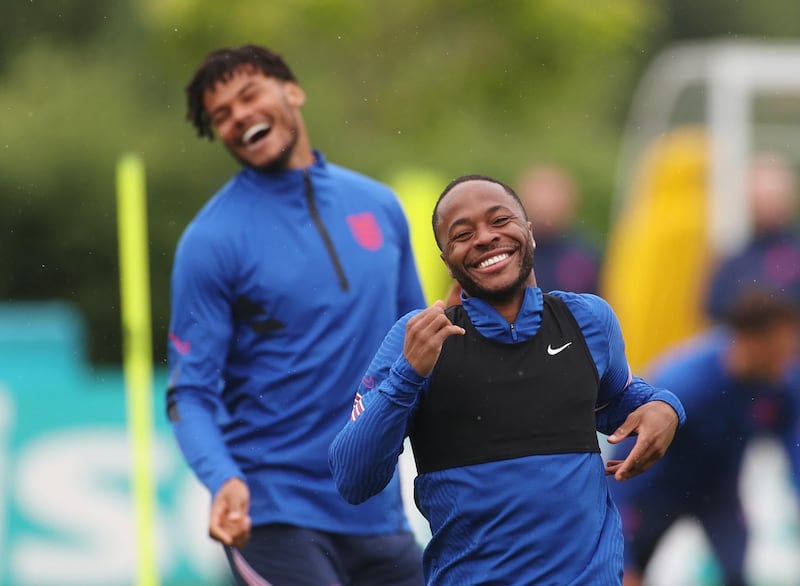England's Raheem Sterling and Tyrone Mings during training at the Tottenham Hotspur Training Centre on Monday, June 21. Reuters