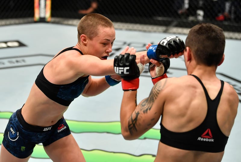 ABU DHABI, UNITED ARAB EMIRATES - JULY 12: In this handout image provided by UFC, (L-R) Rose Namajunas punches Jessica Andrade of Brazil in their strawweight fight during the UFC 251 event at Flash Forum on UFC Fight Island on July 12, 2020 on Yas Island, Abu Dhabi, United Arab Emirates. (Photo by Jeff Bottari/Zuffa LLC via Getty Images)