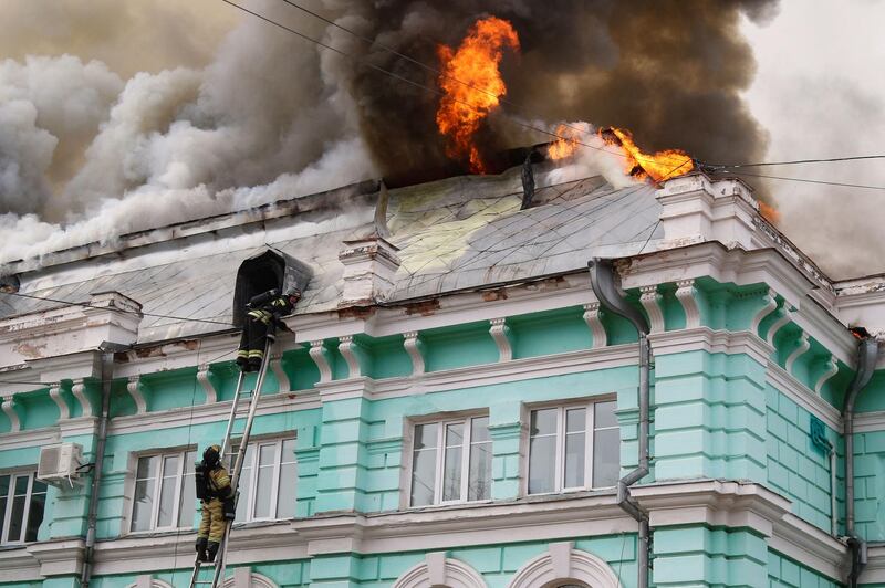 Firefighters battle to extinguish a blaze at a cardiac surgery centre in Blagoveshchensk, in Russia's Far East. AFP