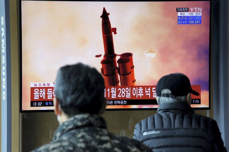 People watch a TV showing a file picture for a news report on North Korea firing two unidentified projectiles, in Seoul, South Korea, March 2, 2020.    REUTERS/Heo Ran     TPX IMAGES OF THE DAY