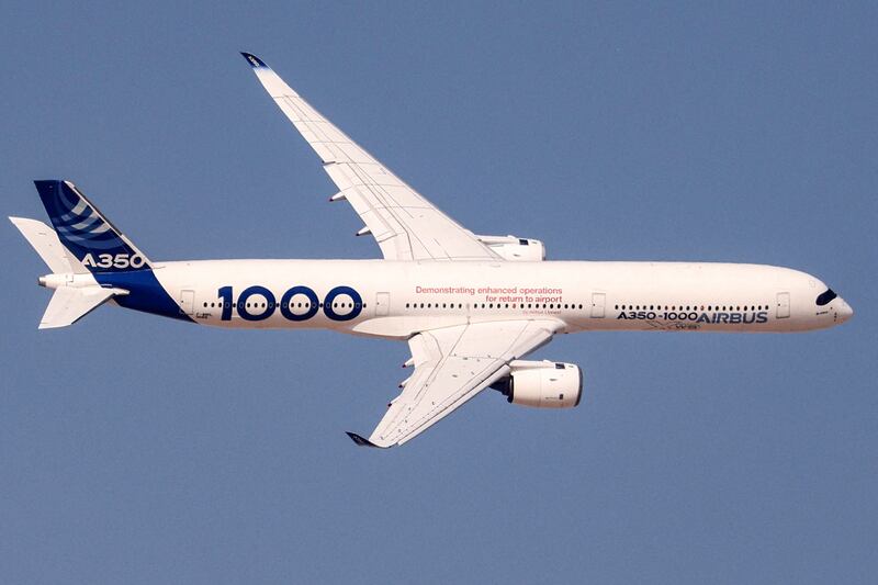 An Airbus A350-1000 flies during the 2023 Dubai Airshow. AFP