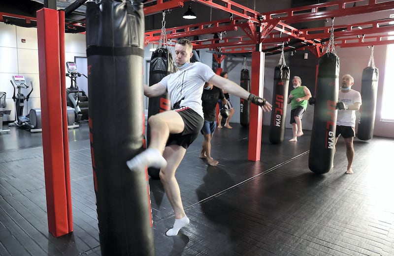 DUBAI, UNITED ARAB EMIRATES , August 10 – 2020 :- Participants during the Kick boxing session at the UFC Gym in Murjan 6 in Jumeirah Beach Residence in Dubai. They are taking part in the 90 minutes MMA Mash up. (Pawan Singh / The National) For News/Online/Instagram. Story by Nick Webster