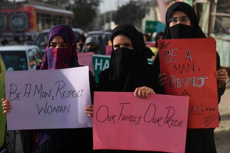 Pakistani women activist hold placards durig a rally ahead of the International Women's Day in Karachi on March 6, 2020.  / AFP / Asif HASSAN
