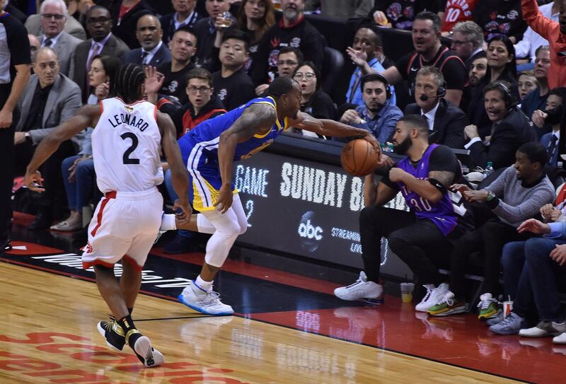 Golden State Warriors guard Andre Iguodala reaches for the ball as Drake moves out of the way. EPA