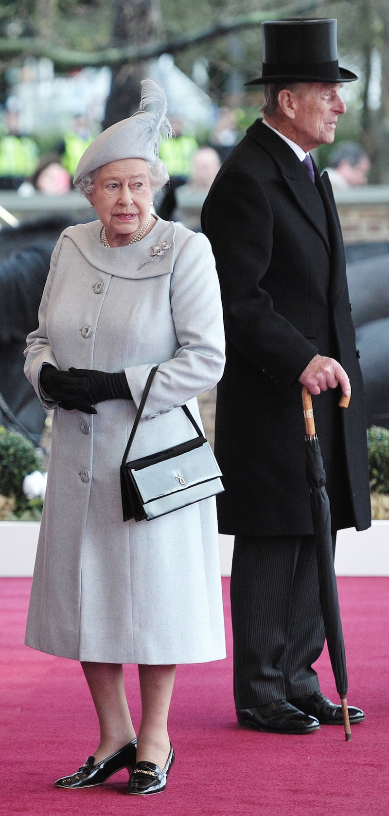 Queen Elizabeth II, in light blue, and Prince Philip, Duke of Edinburgh, await the arrival of Sheikh Sabah Al-Ahmad Al-Jaber Al-Sabah of Kuwait at Windsor Castle during a three-day state visit on November 27, 2012. Getty Images