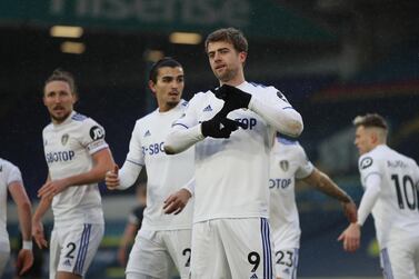 epa08906149 Patrick Bamford (C) of Leeds gestures after scoring a goal during the English Premier League soccer match between Leeds United and Burnley FC in Leeds, Britain, 27 December 2020. EPA/Molly Darlington / POOL EDITORIAL USE ONLY. No use with unauthorized audio, video, data, fixture lists, club/league logos or 'live' services. Online in-match use limited to 120 images, no video emulation. No use in betting, games or single club/league/player publications.