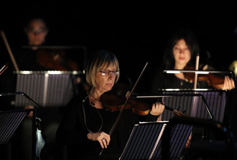 The string section of the Armenian State Symphony Orchestra during 'Joker: Live in Concert'  on Tuesday at the Dubai Opera.