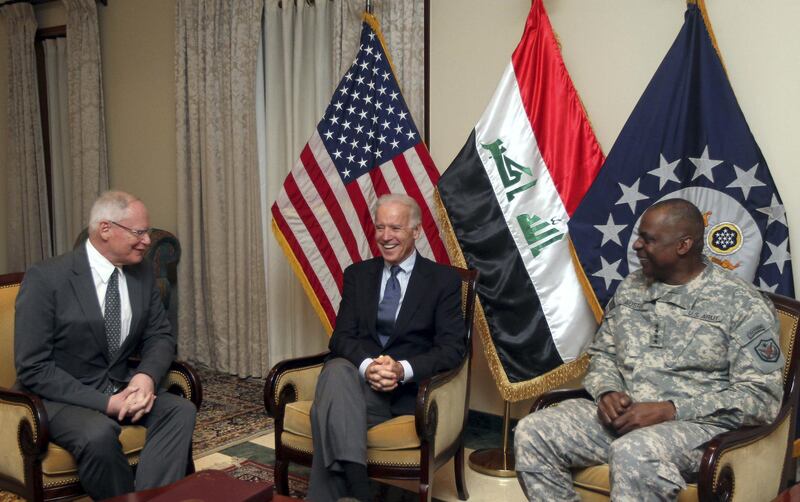 US Vice President Joe Biden meets with US ambassador James Jeffrey (L) and General Lloyd Austin, the commander of United States Forces - Iraq (USF-I), at the US embassy upon arrival at Baghdad on a surprise visit on November 29, 2011, during which he is due to meet top Iraqi officials, as American troops depart Iraq ahead of a year-end deadline. AFP PHOTO/AHMAD AL-RUBAYE (Photo by AHMAD AL-RUBAYE / AFP)