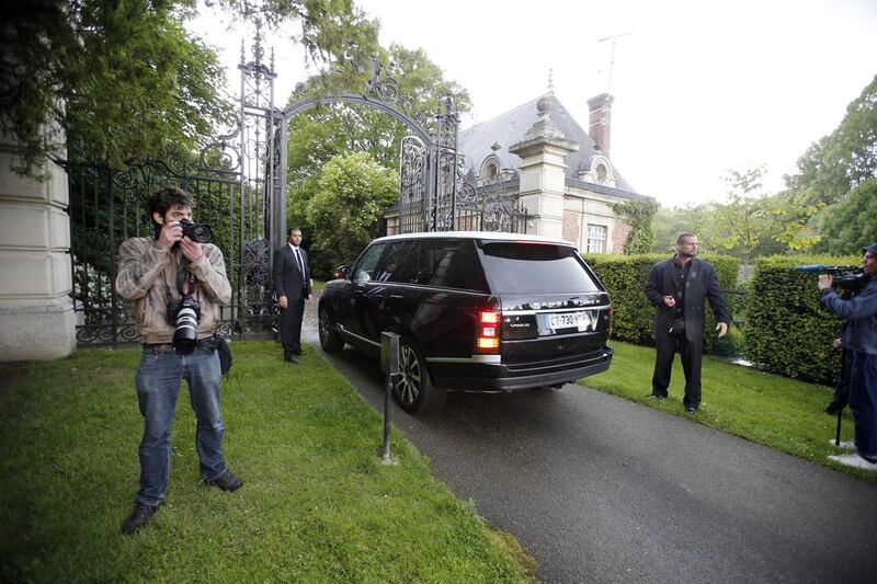 One of the cars of Kim Kardashian, Kanye West and their guests arrives at the entrance of the Wideville Castle, in Davron. Francois Mori / AP photo
