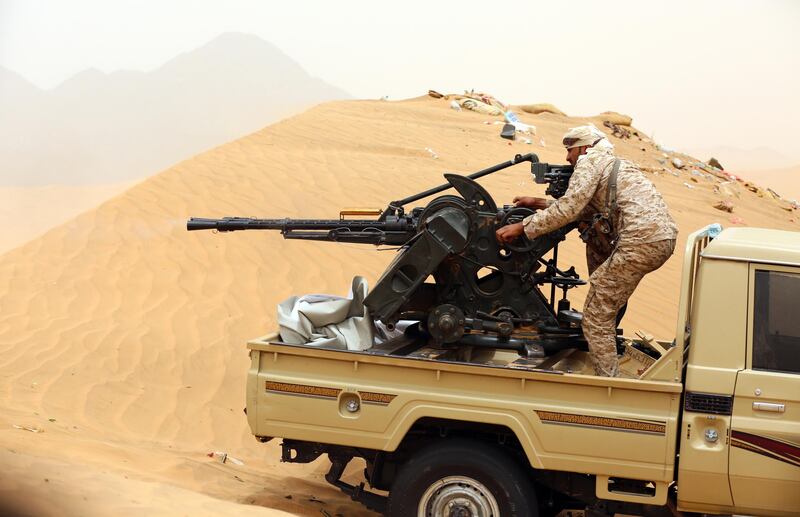 A Yemeni tribesman from the Popular Resistance Committees, supporting forces loyal to Yemen's Saudi-backed President, manoeuvrers a gun mounted on a pick up truck during fighting against Shiite Huthi rebels and their allies on June 30, 2017 in the area of Sirwah, west of Marib city.
Six soldiers were killed in Yemen on June 29, a military source said, as government forces seek to cement their control over Marib province, east of the rebel-held capital. / AFP PHOTO / ABDULLAH AL-QADRY