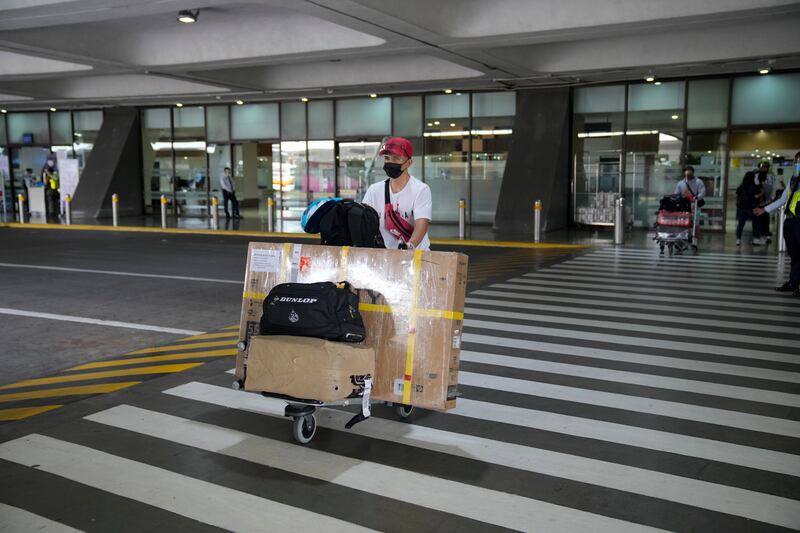 A passenger at Manila's International Airport. Upon arrival in Manila, a 10-day hotel quarantine period will apply, followed by a further four days in mandatory home quarantine. AP