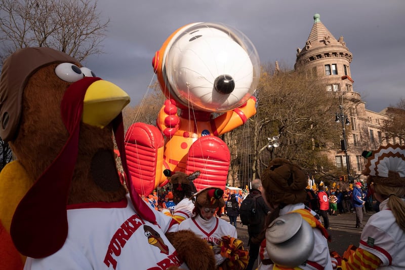 Snoopy Astronaut balloon is aloft at the start of the Macy's Thanksgiving Day Parade in New York. AP